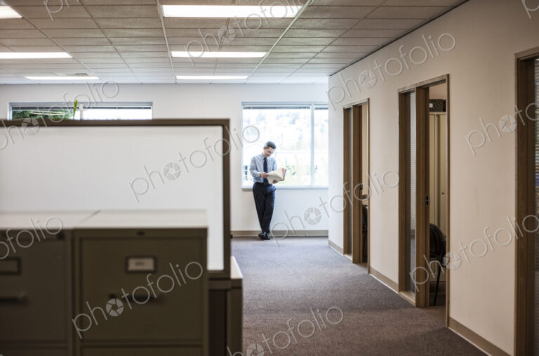 Caucasian man executive in office hallway
