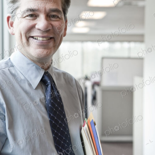 Caucasian man executive in office hallway