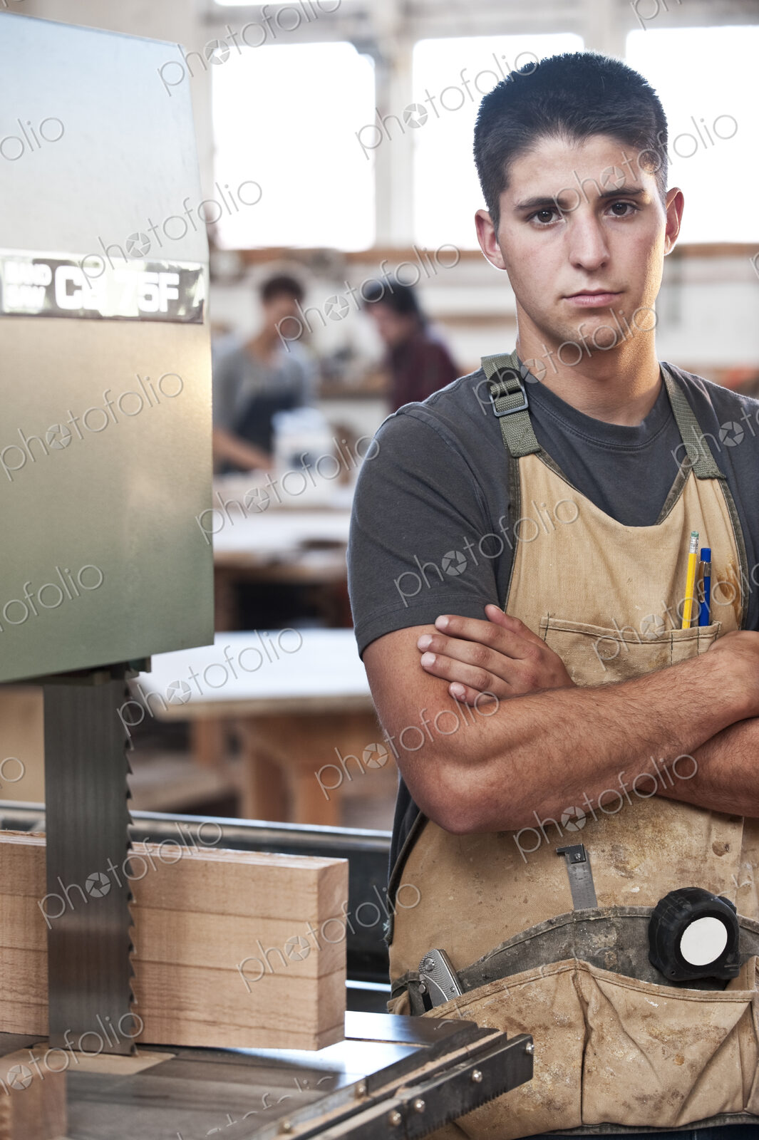 Caucasian man factory worker at a work station in a woodworking factory.
