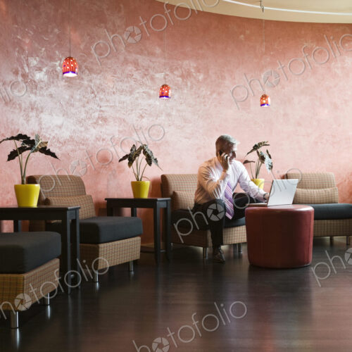 Caucasian man in an hip office lobby area