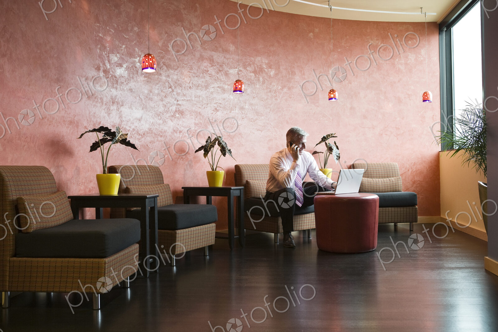 Caucasian man in an hip office lobby area