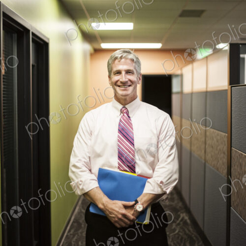 Caucasian man in an office hallway