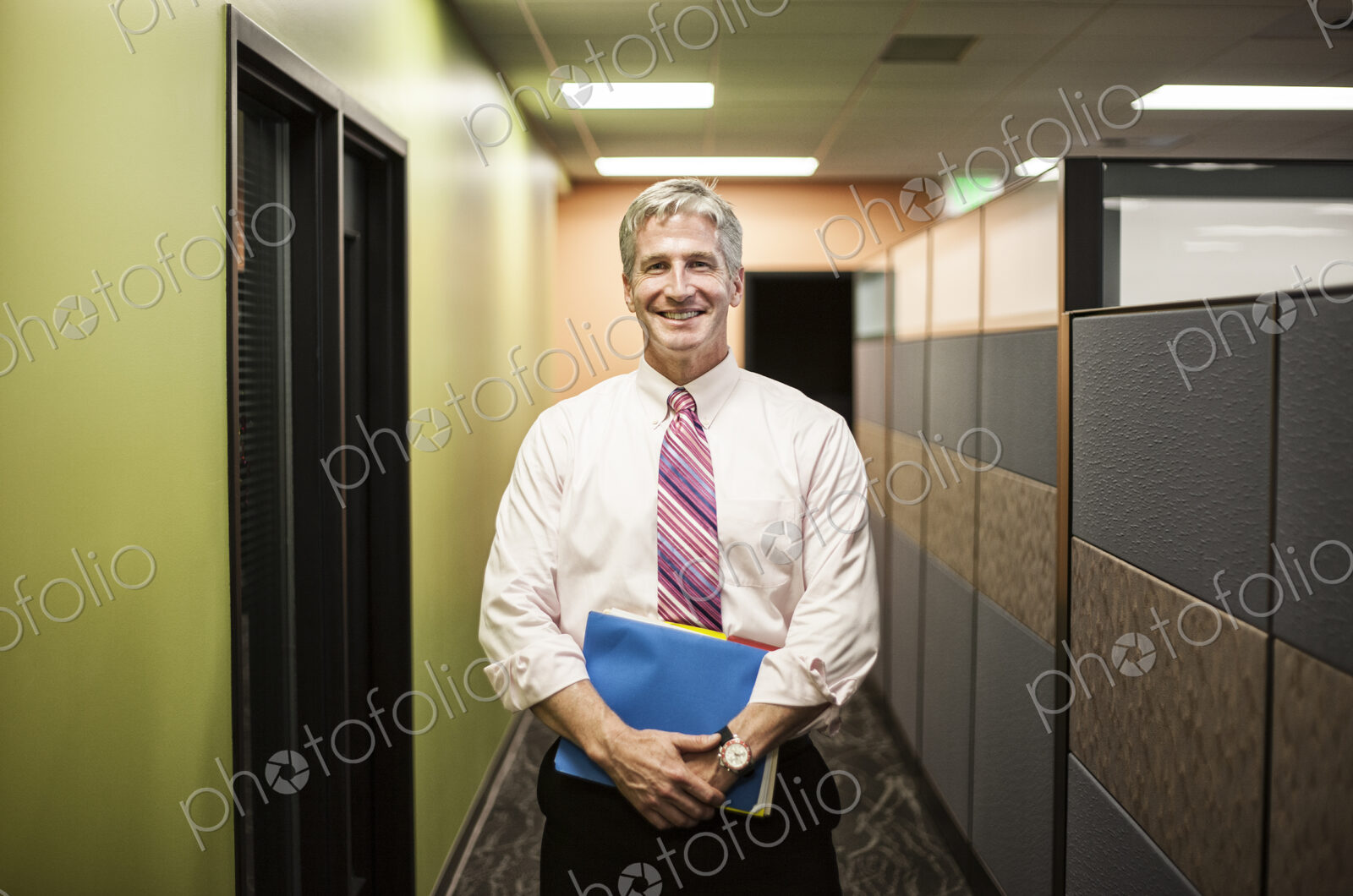 Caucasian man in an office hallway