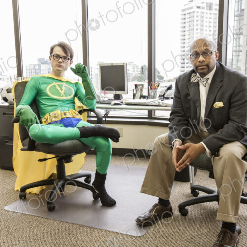 Caucasian man office super hero with his advisor, a black business man. Caucasian man office super hero with his advisor, a black business man.