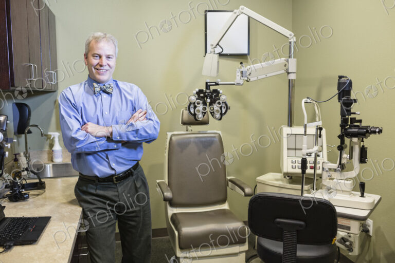 Caucasian man ophthalmologist in his examination room.