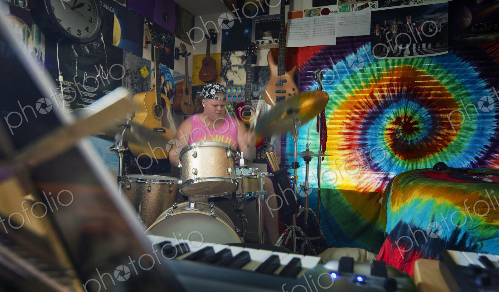 Caucasian man playing drums in music studio