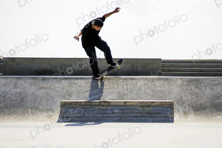 Caucasian man riding skateboard in skate park