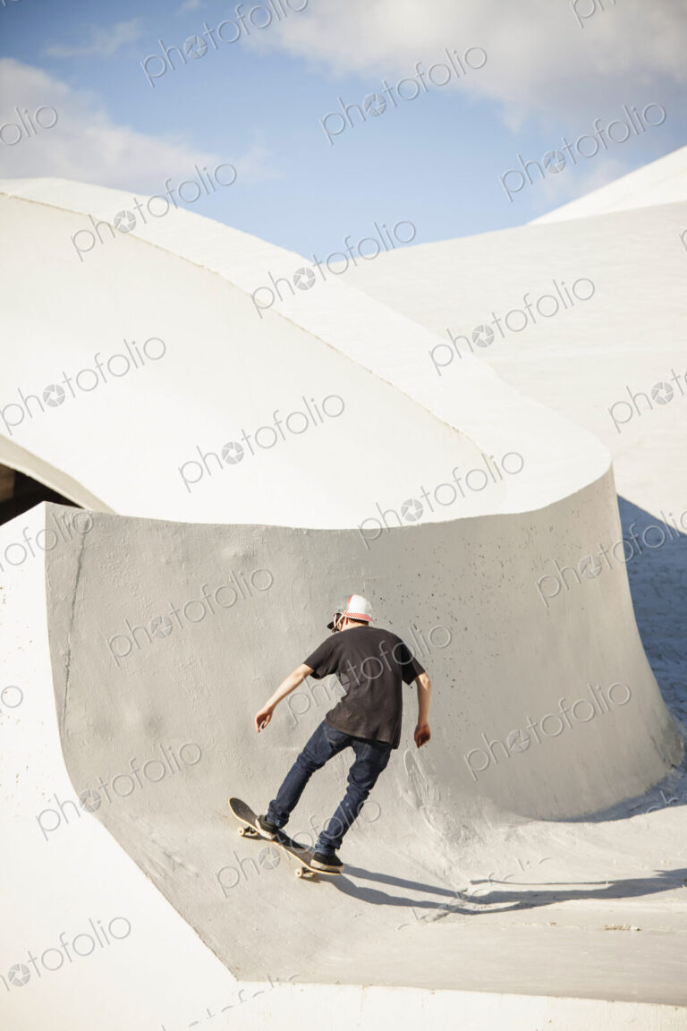 Caucasian man skating at skate park