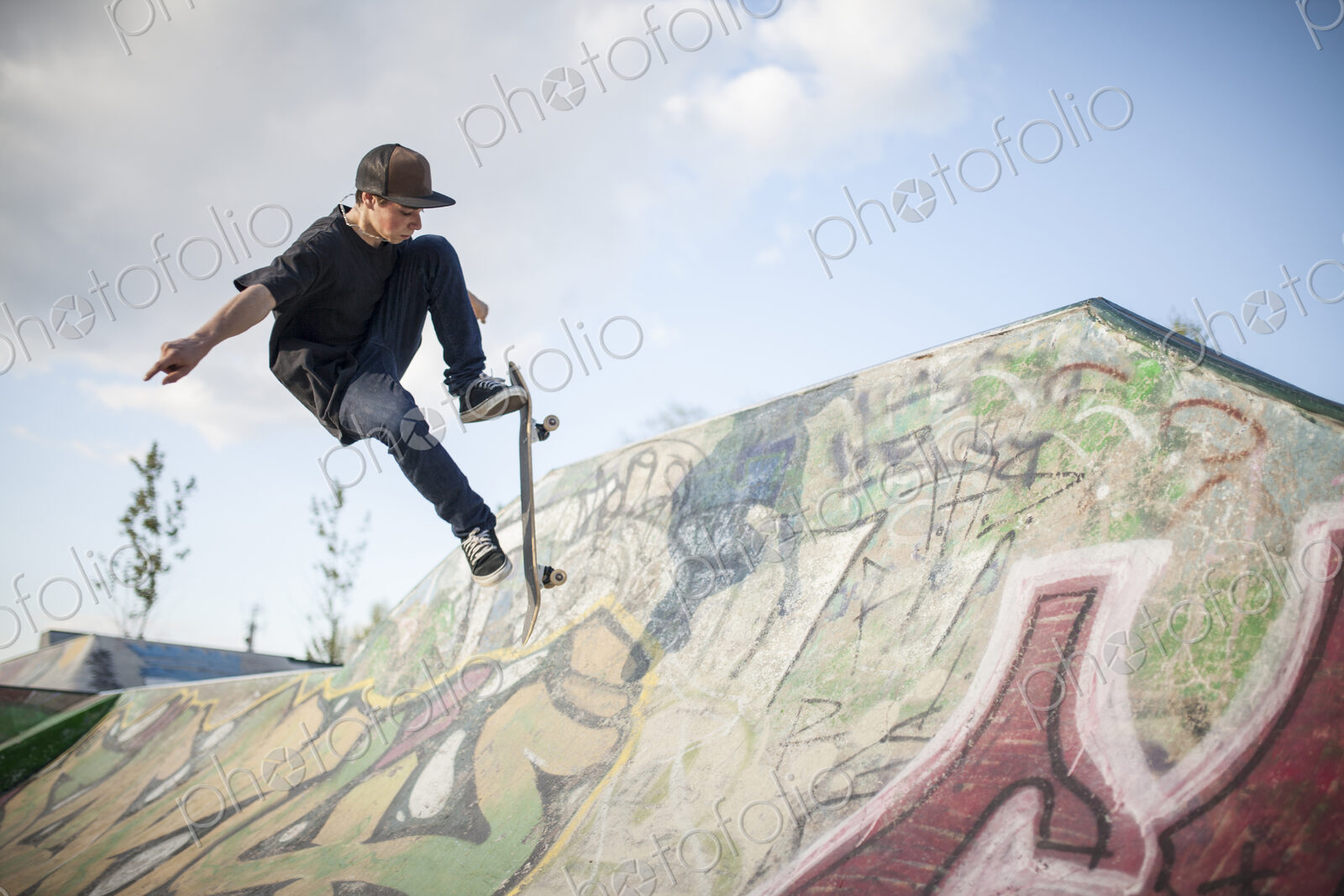 Caucasian man skating at skate park