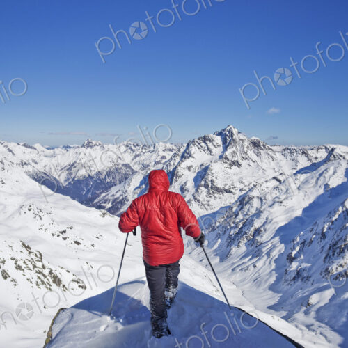 Caucasian man skiing on snowy mountaintop