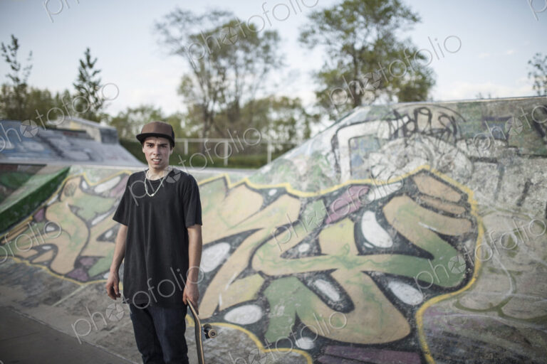 Caucasian man standing at skate park