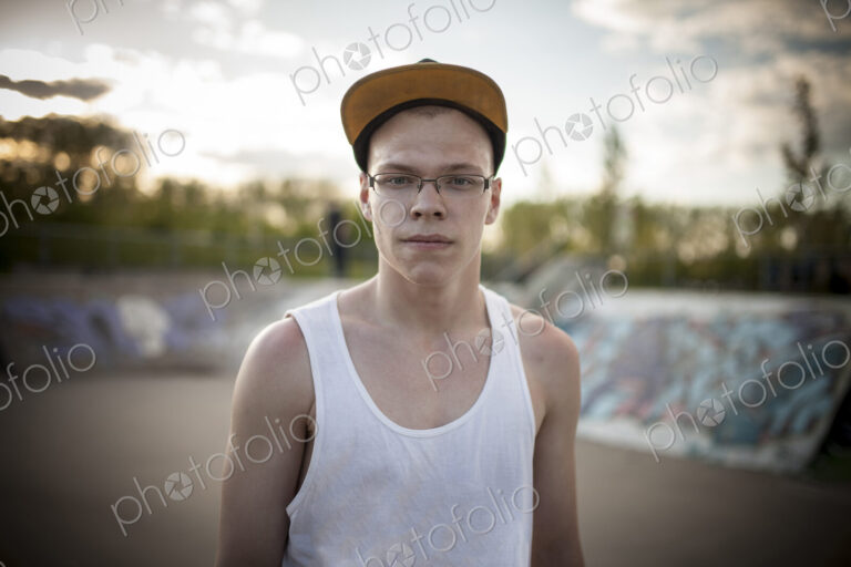 Caucasian man standing at skate park