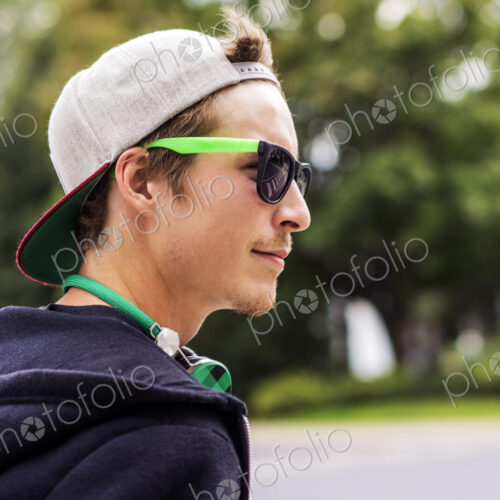 Caucasian man wearing sunglasses and headphones Caucasian man wearing sunglasses and headphones