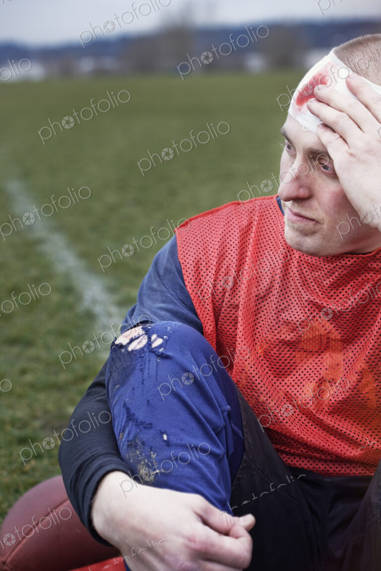 Caucasian man who has a head injury in a sporting event.