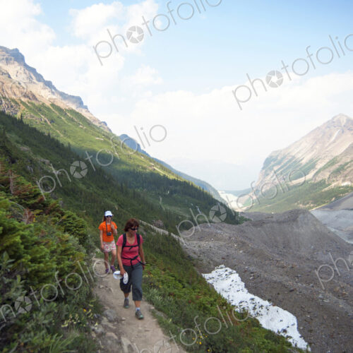 Caucasian mother and daughter hiking on Six Glaciers Trail, Banff, Alberta, Canada