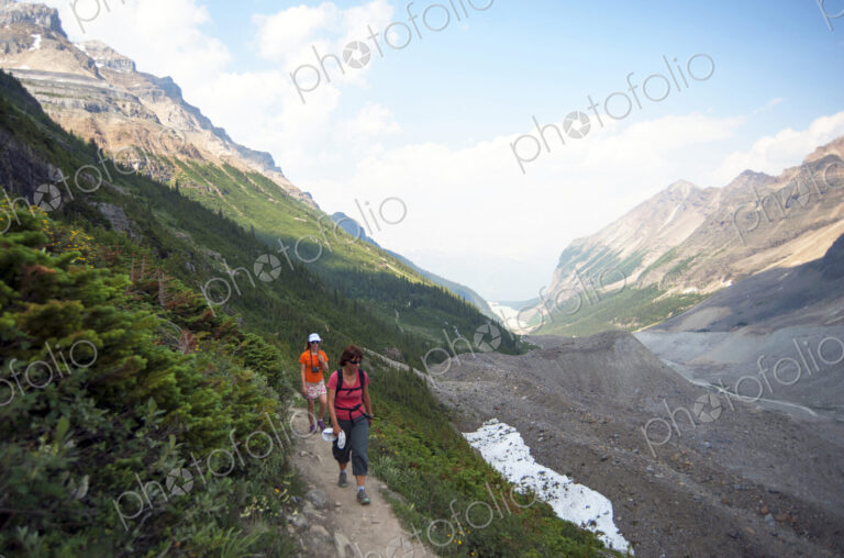 Caucasian mother and daughter hiking on Six Glaciers Trail, Banff, Alberta, Canada