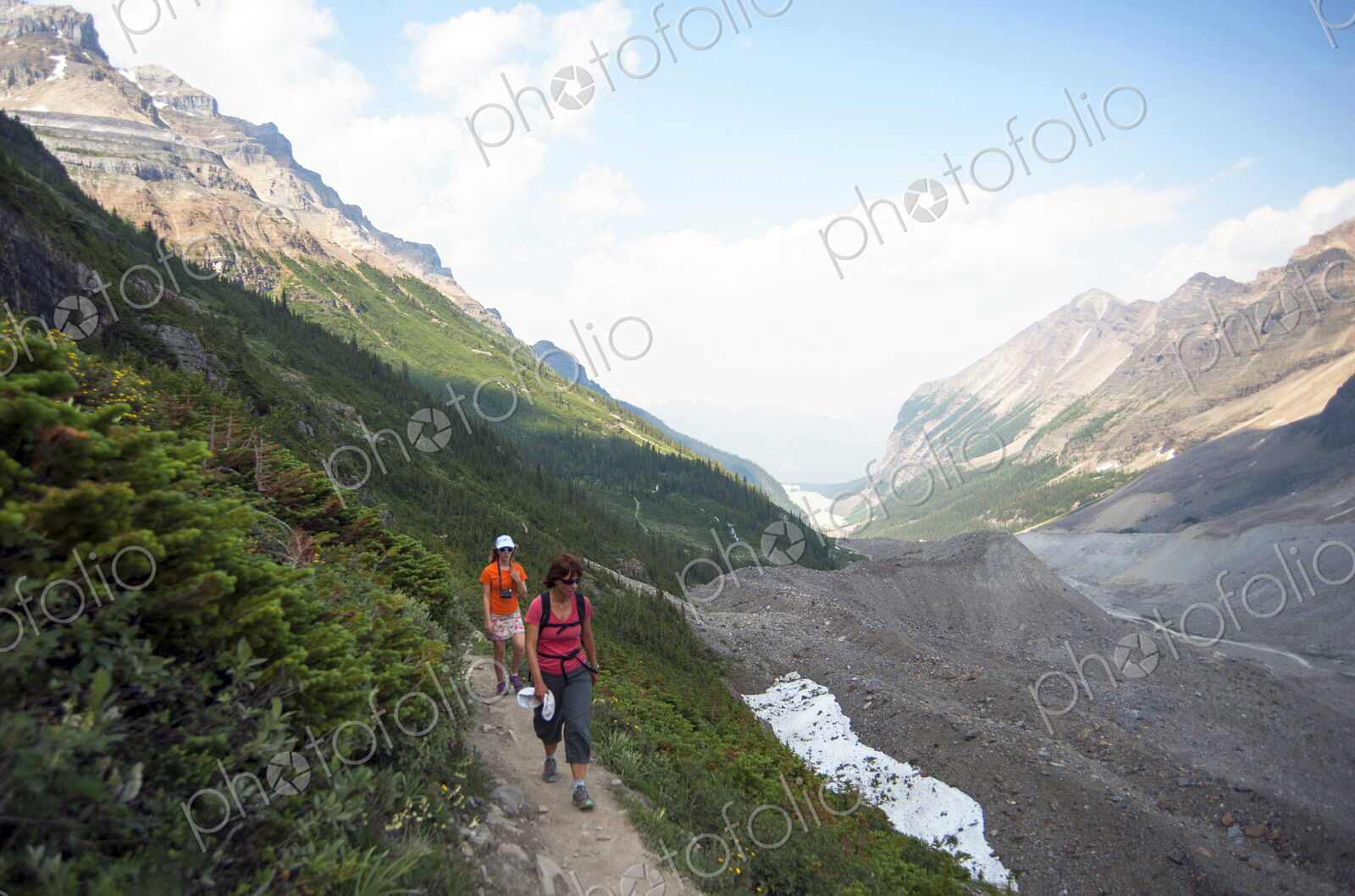Caucasian mother and daughter hiking on Six Glaciers Trail, Banff, Alberta, Canada