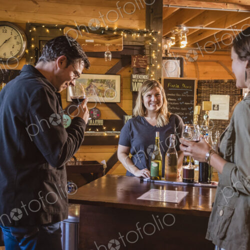 Caucasian people drinking wine in winery