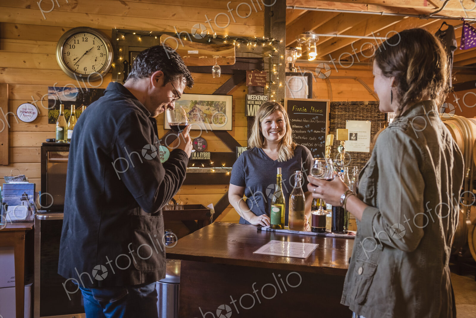 Caucasian people drinking wine in winery