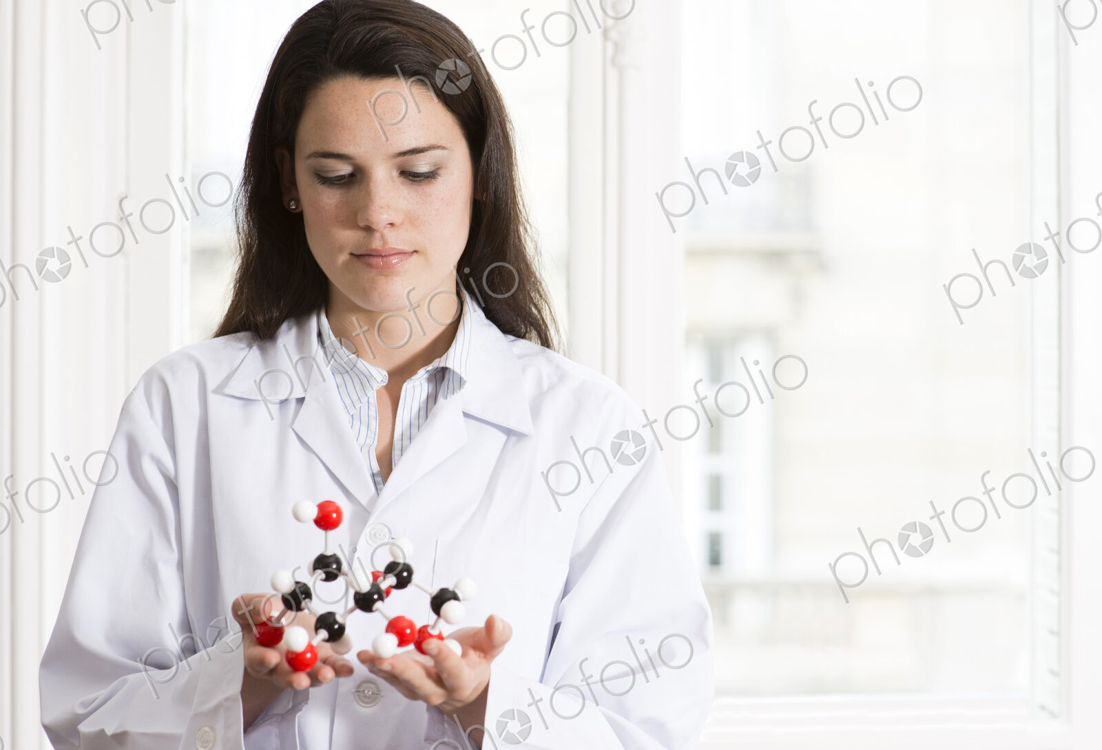 Caucasian scientist examining molecular model