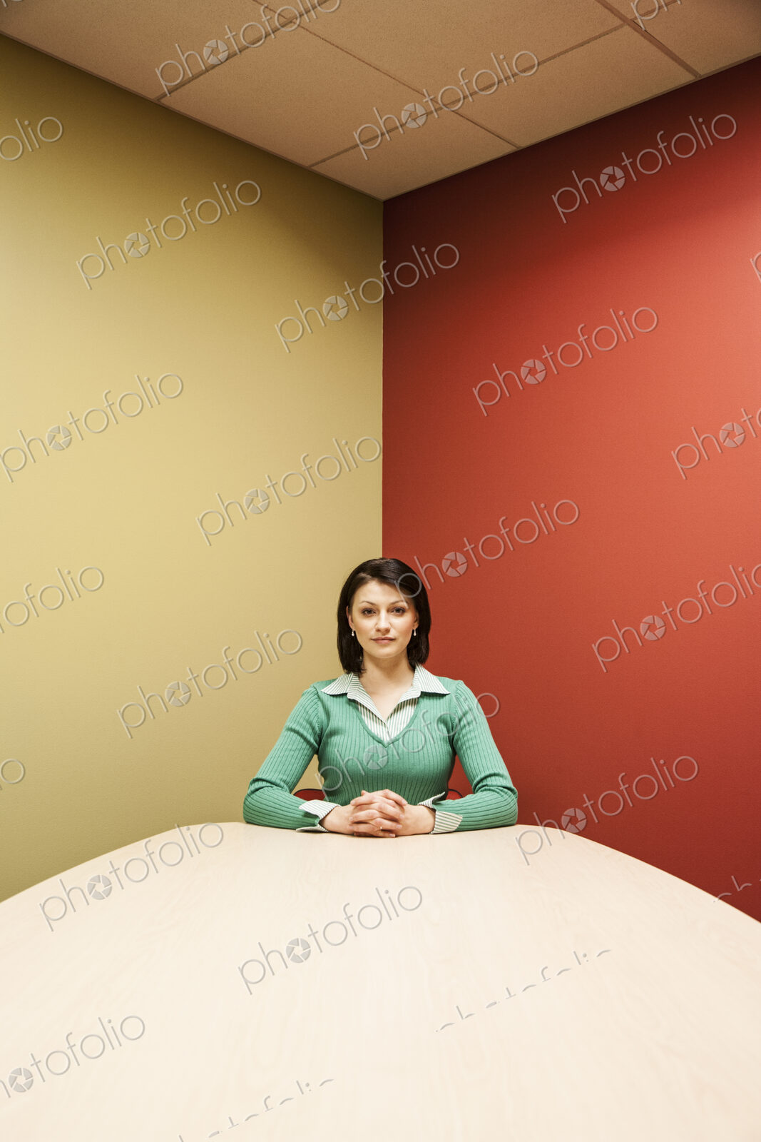 Caucasian woman at a colorful conference room table