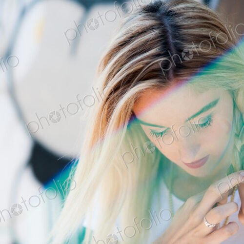Caucasian woman braiding her hair Caucasian woman braiding her hair