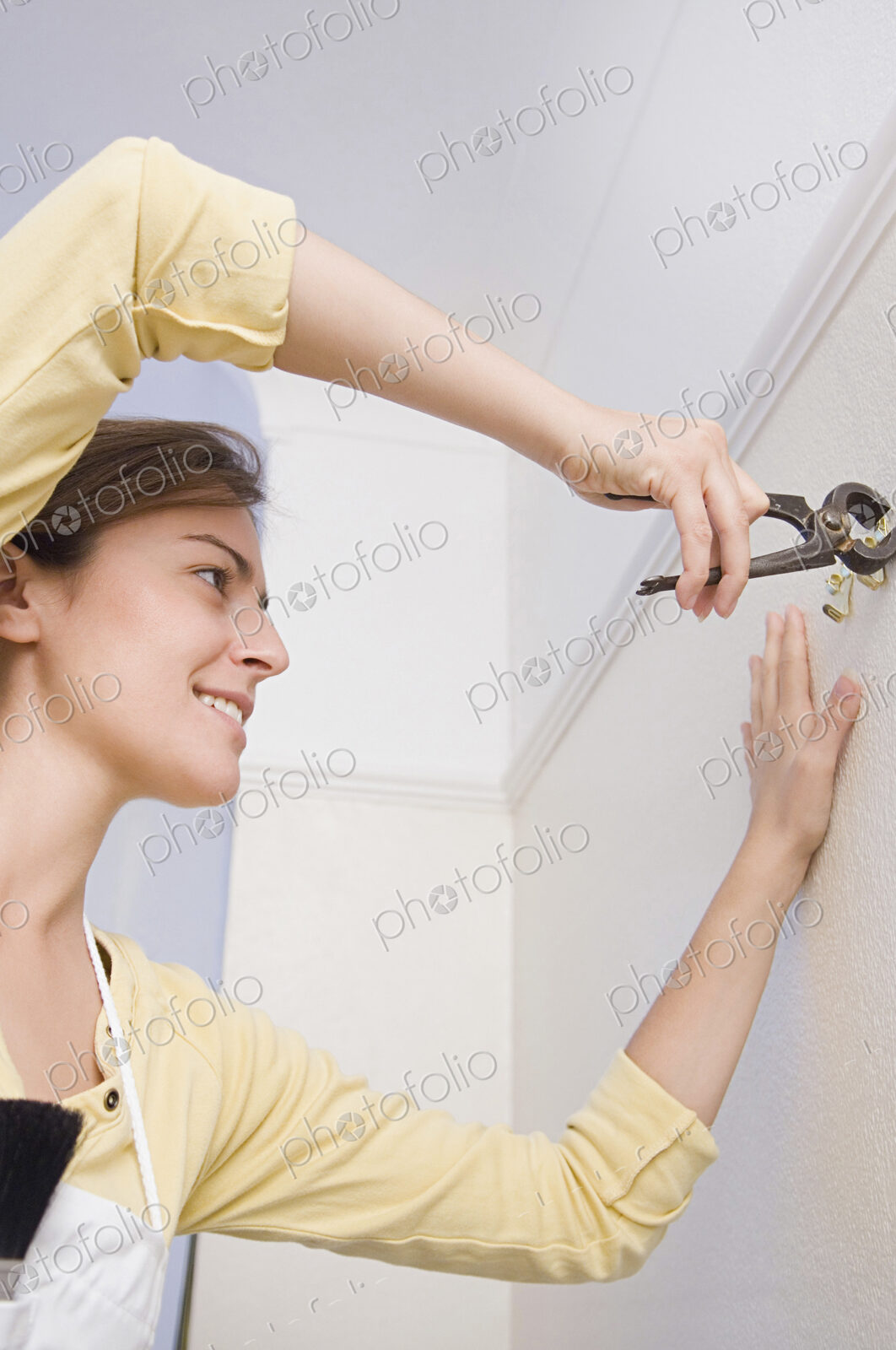 Caucasian woman doing home repair