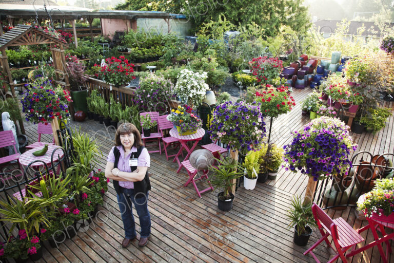 Caucasian woman owner of a large garden center nursery.