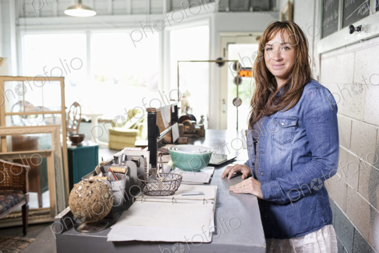 Caucasian woman owner of a small antique store.