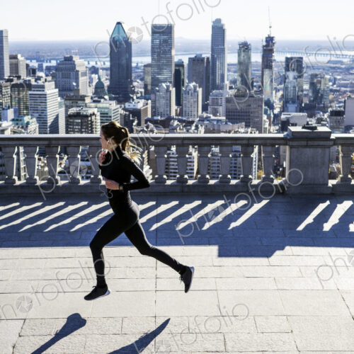 Caucasian woman running in city Caucasian woman running in city