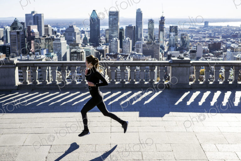 Caucasian woman running in city