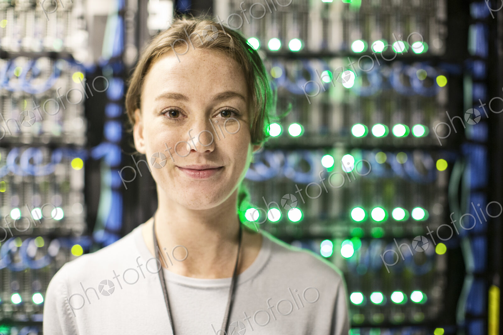 Caucasian woman technician in a large computer server farm.