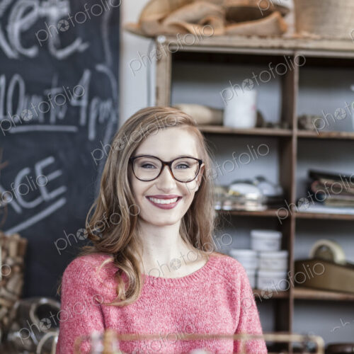 Caucasian woman working at an antique store