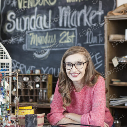 Caucasian woman working at an antique store