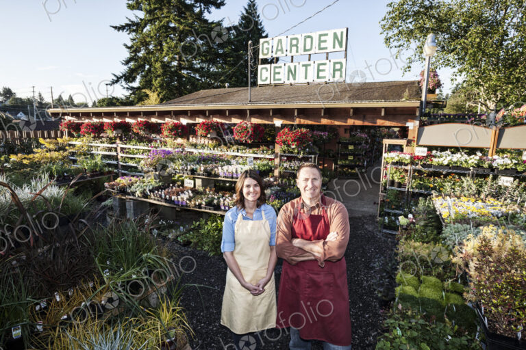 Caucasin man and woman garden center nursery owners.