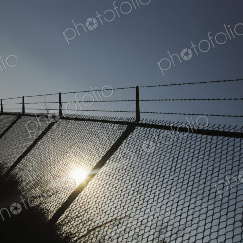 Chain Link and Barbed Wire Fence