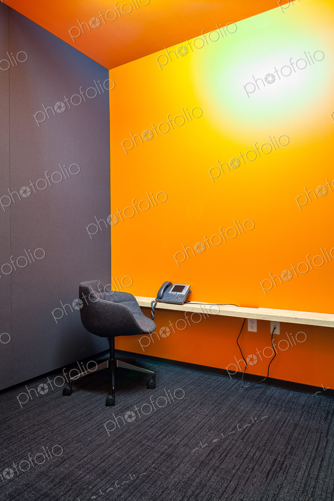 Chair, desk and phone in empty office