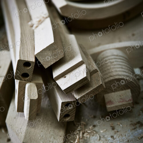 Chair legs and parts of the chair back on a workbench. Chair legs and parts of the chair back on a workbench.
