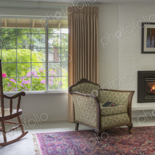 Chairs and fireplace in traditional living room
