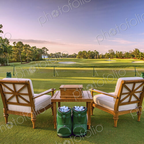 Chairs and golf balls on driving range Chairs and golf balls on driving range