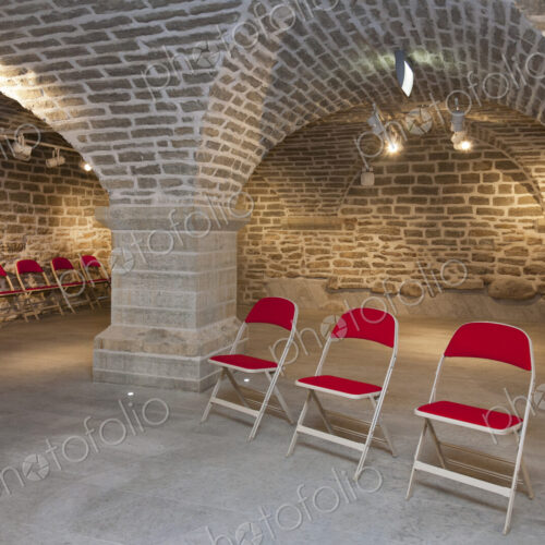 Chairs in a vaulted stone room for lectures meetings or seminars at a university Chairs in a vaulted stone room for lectures meetings or seminars at a university