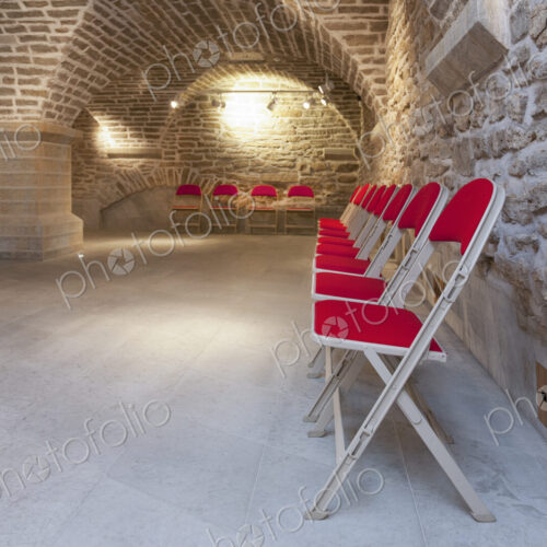 Chairs in a vaulted stone room for lectures meetings or seminars at a university Chairs in a vaulted stone room for lectures meetings or seminars at a university