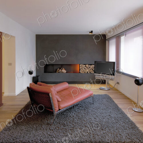 Chaise longue, sofa, fireplace and rug in modern living room