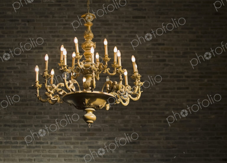 Chandelier and Brick Wall