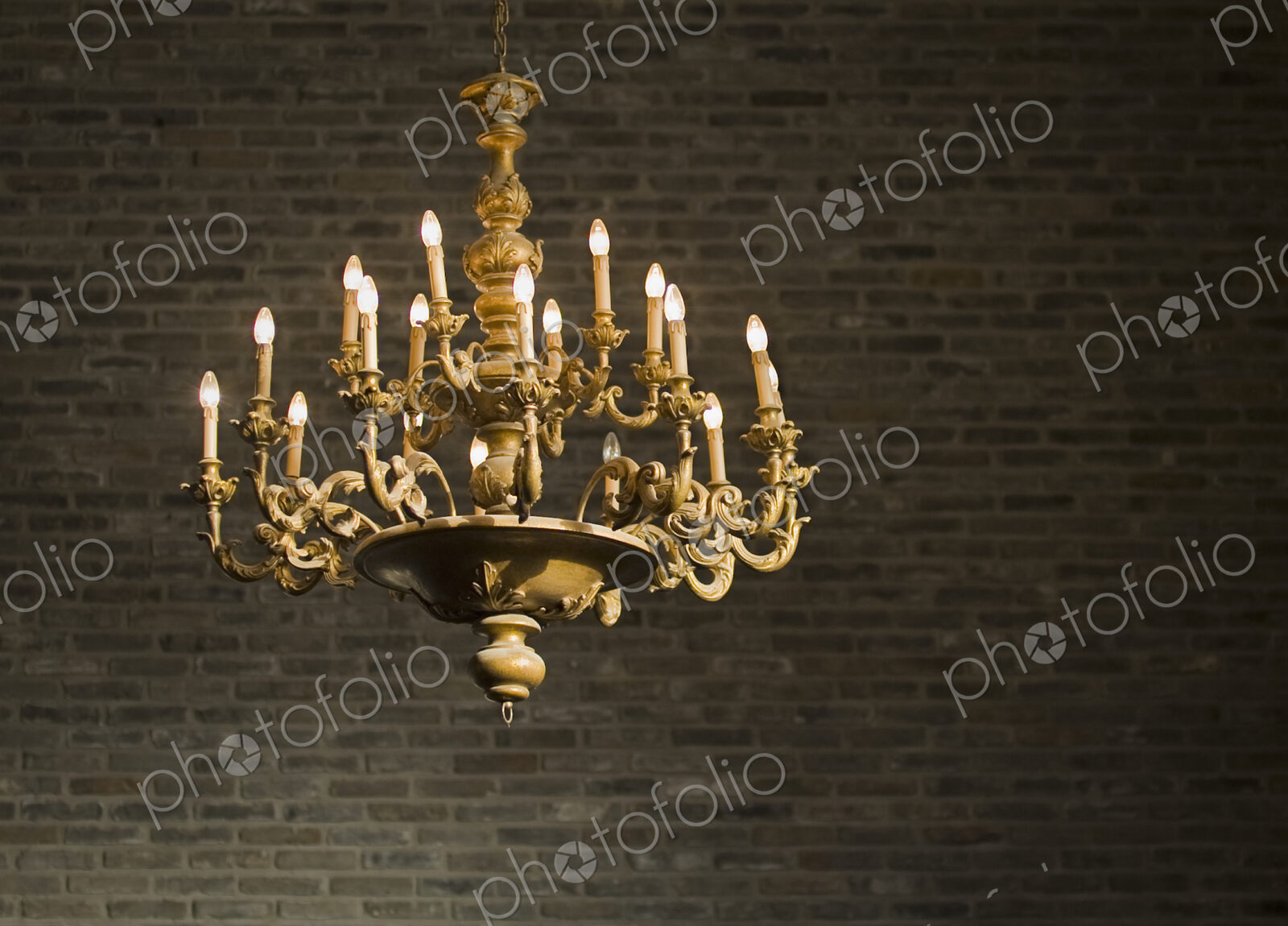 Chandelier and Brick Wall