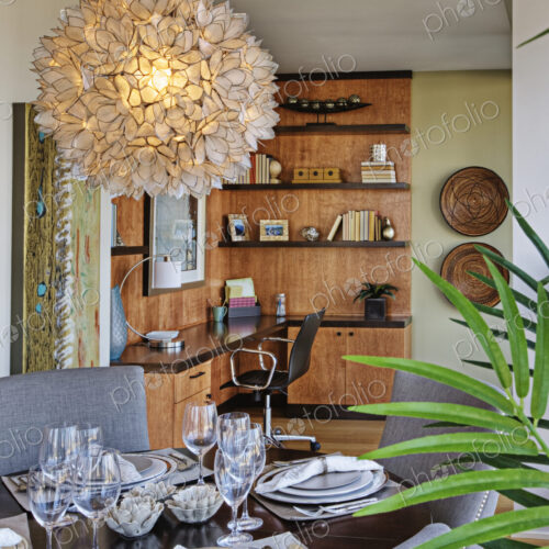 Chandelier over luxury dining room table