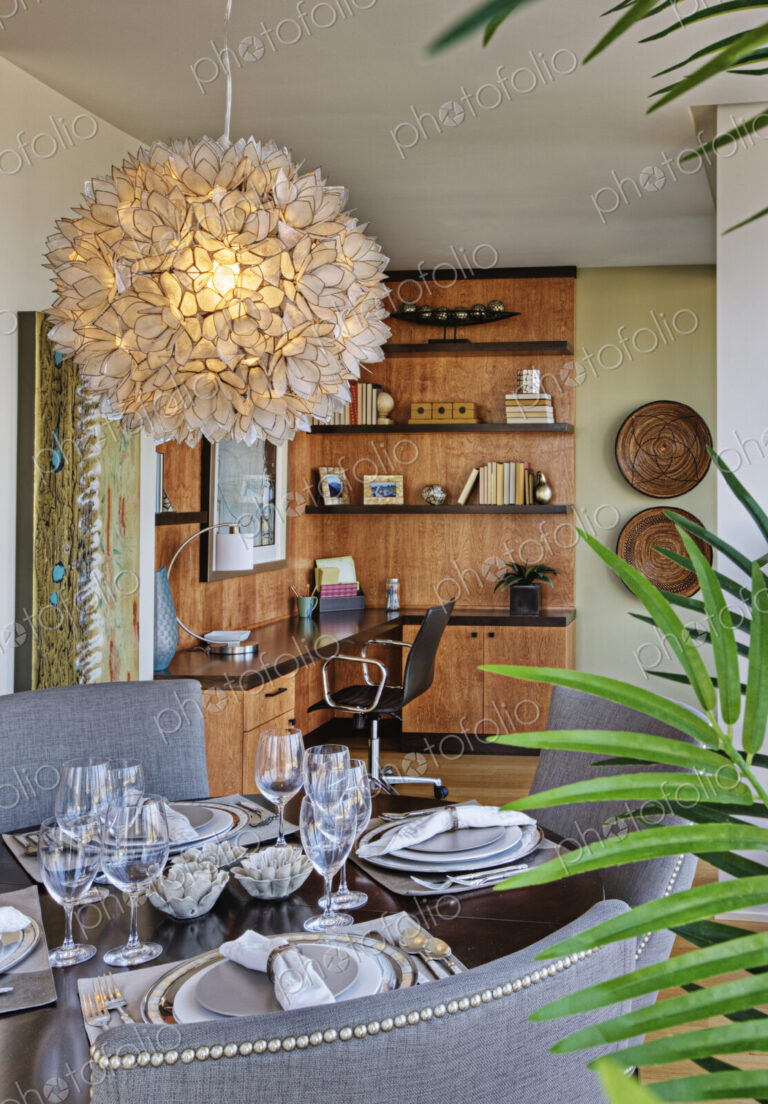 Chandelier over luxury dining room table