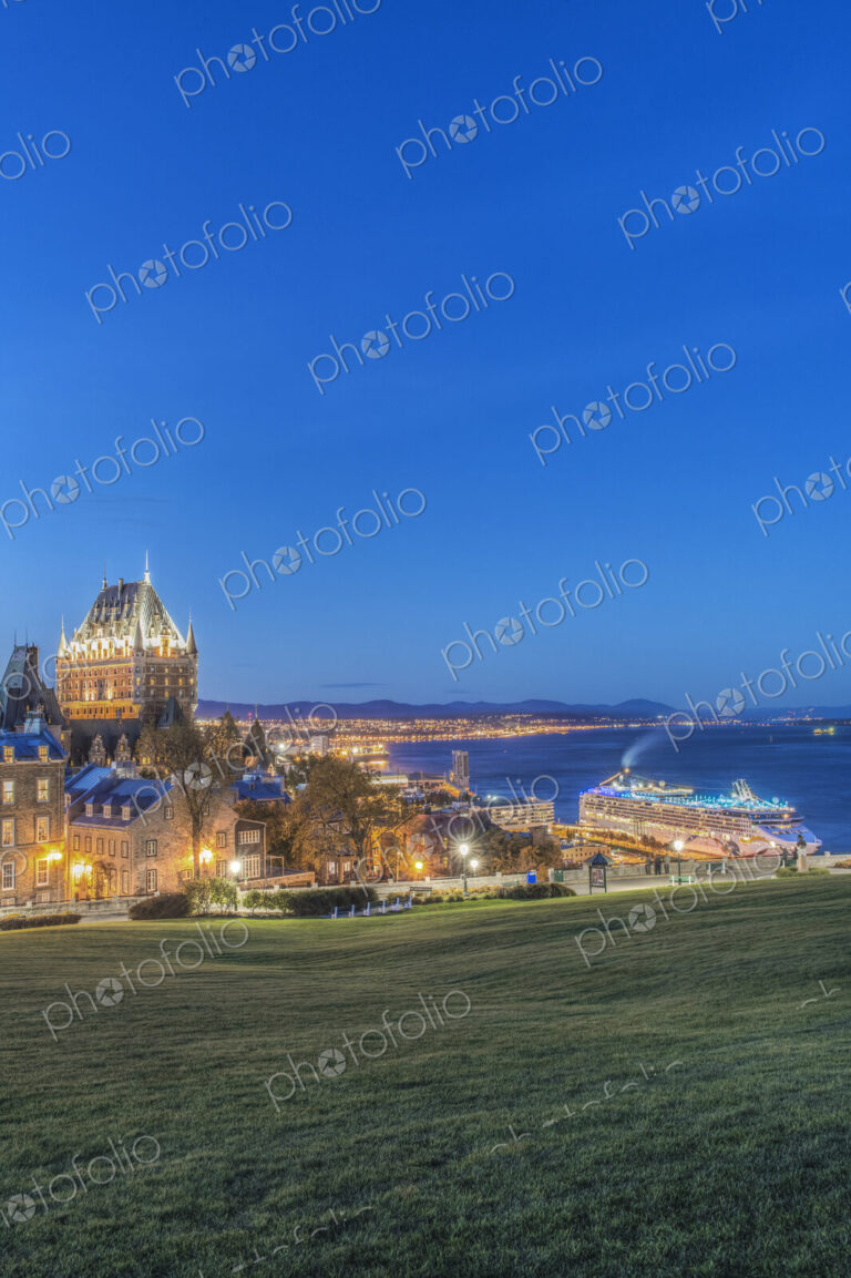 Chateau Frontenac, lit up at night in Quebec City, view over the St Lawrence river.
