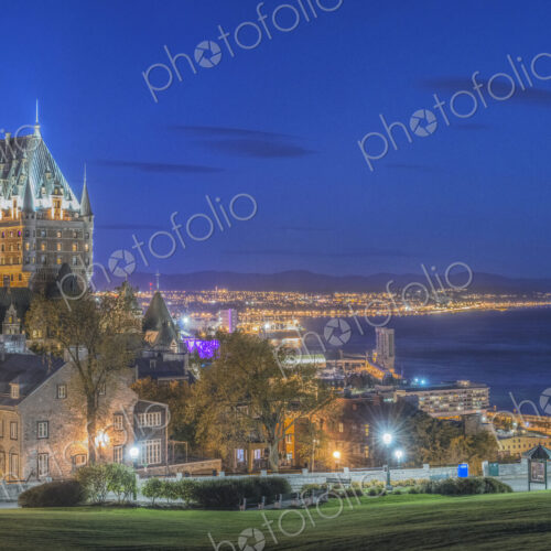 Chateau Frontenac, lit up at night in Quebec City, view over the St Lawrence river.
