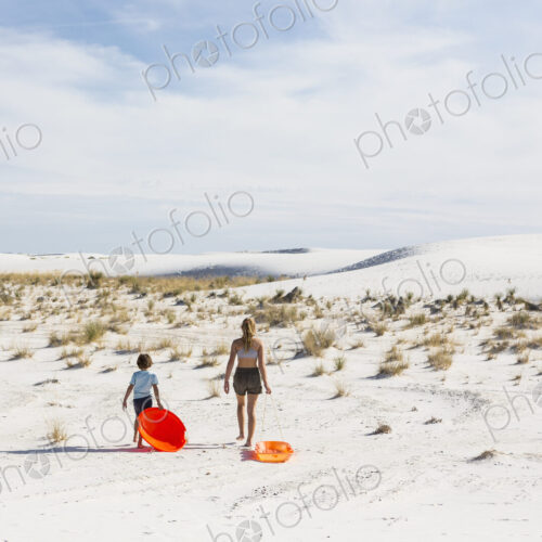 Children pulling sleds, White Sands Nat'l Monument, NM Children pulling sleds, White Sands Nat'l Monument, NM